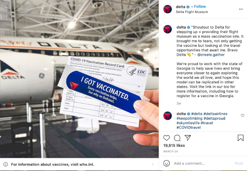 A screenshot of an Instagram post on Delta's feed. It shows a photo submitted by a person holding a sticker that says they got vaccinated – with a testimonial and Delta's airplane in the background