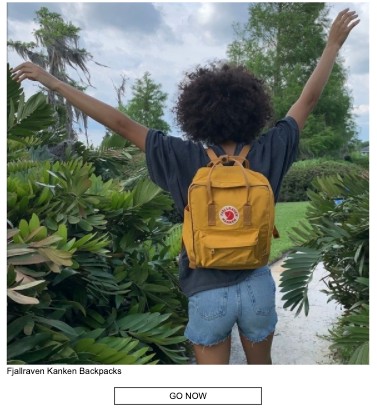 A woman stretching her arms towards the sky as she's wearing a yellow backpack in an outdoor setting, surrounded by green vegetation