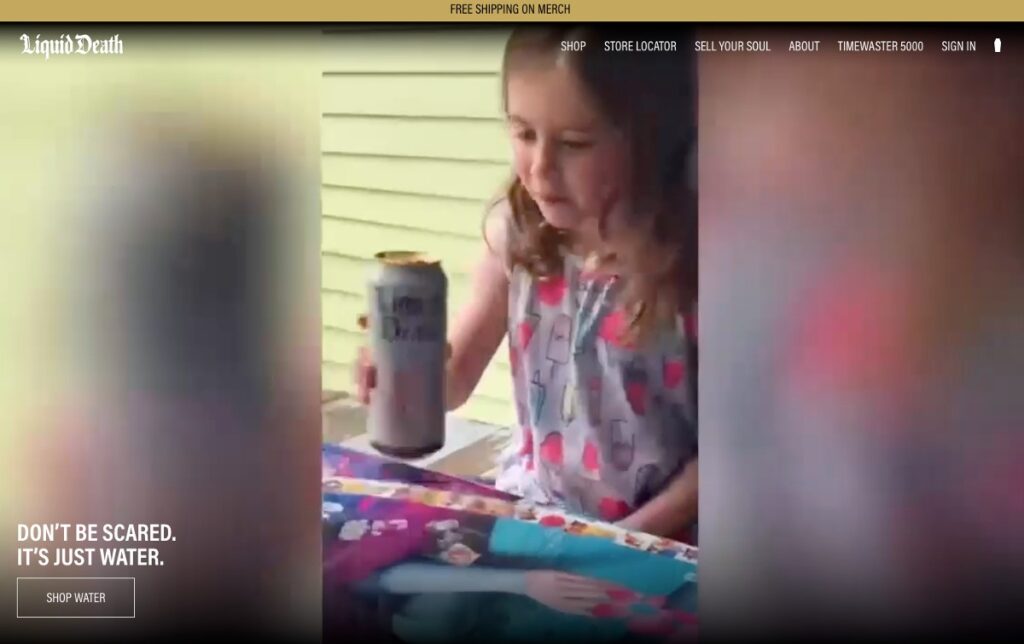 a little girl drinking from a beer-like can (but it's just Liquid Death)