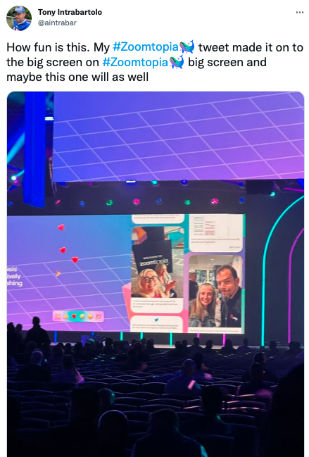 A tweet by a Zoomtopia guest that says "How fun is this. My #Zoomtopia tweet made it on to the big screen on #Zoomtopia and maybe this one will as well" – he also shared a photo of the screen displaying UGC.